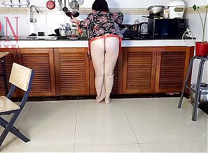Housewife in pantyhose in the kitchen. Naked maid gets an orgasm while cooking. 